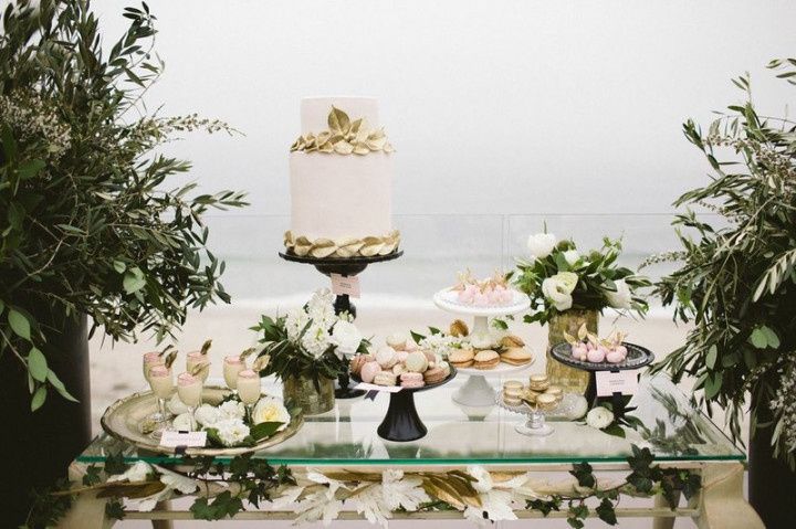 wedding dessert table with cake and macarons