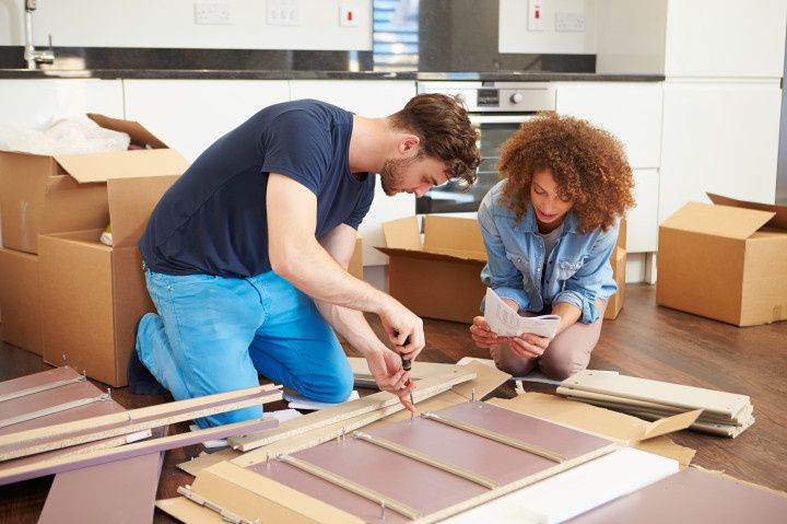 couple building furniture