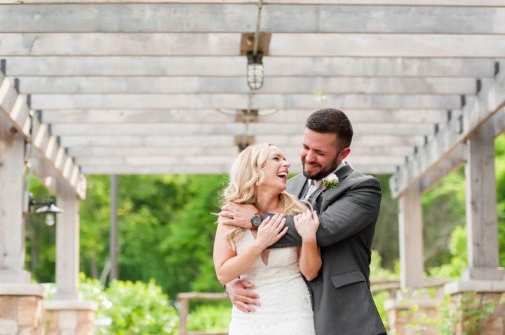 couple hugging in garden setting