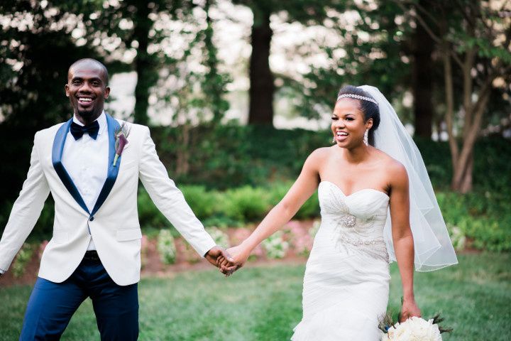 newly married couple walking hand in hand