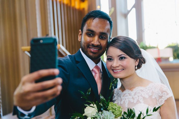 bride and groom taking a selfie