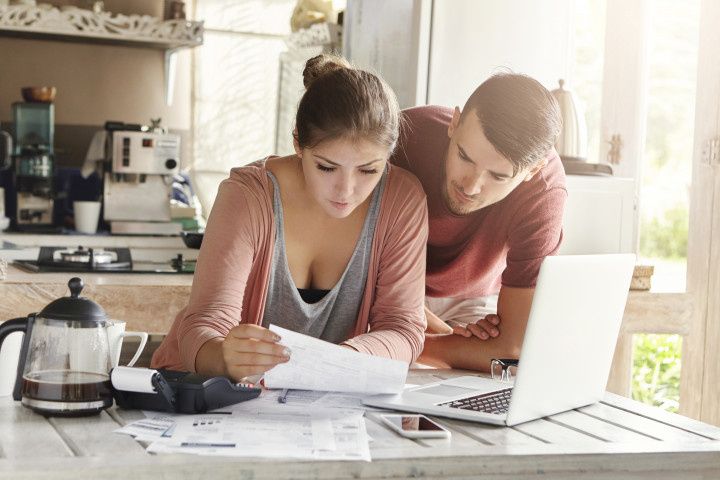 couple paying taxes