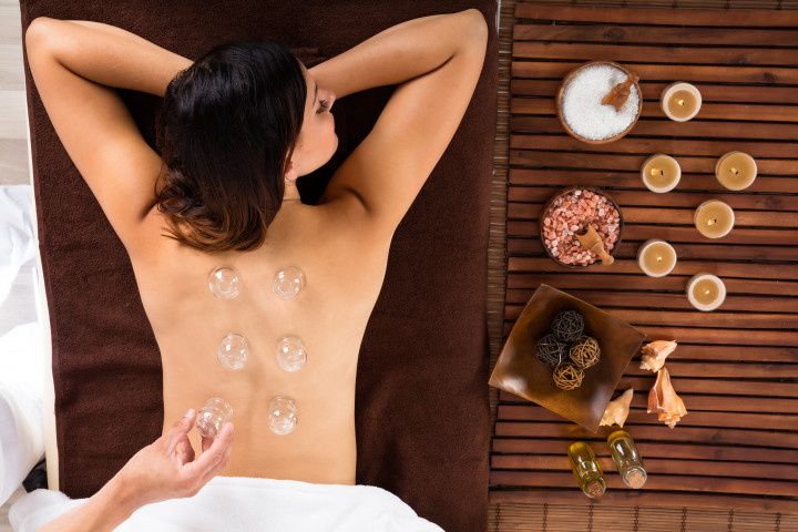 woman doing cupping therapy