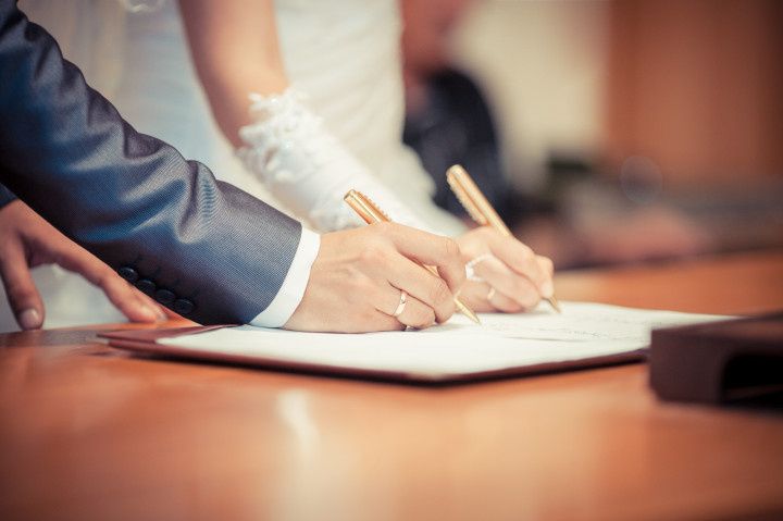 couple signing marriage license