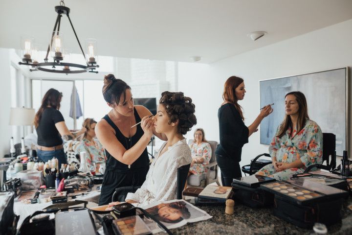 bride getting makeup done