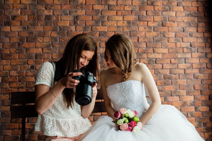 bride with wedding photographer