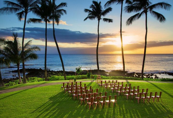 outdoor oceanfront wedding ceremony at sunset