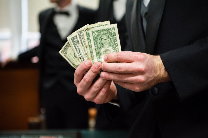 wedding guest holding money