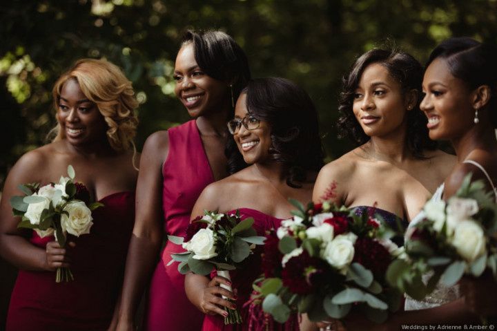 bridesmaids wearing red dresses