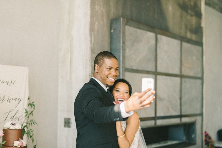 wedding couple taking selfie
