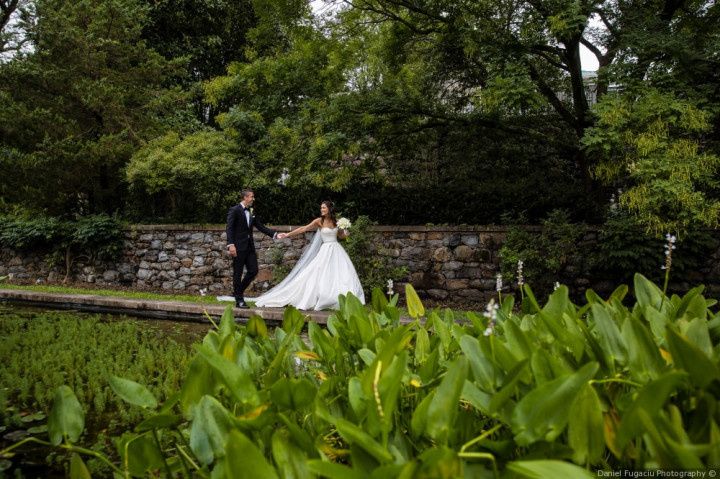 couple walking garden wedding