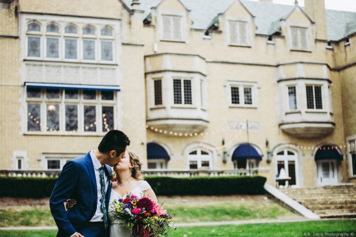 couple kissing in front of laurel hall indiana