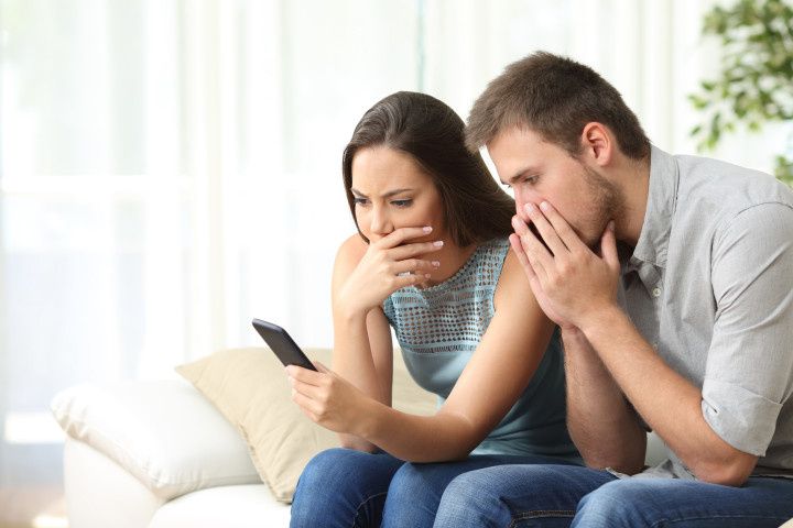 couple looking at phone