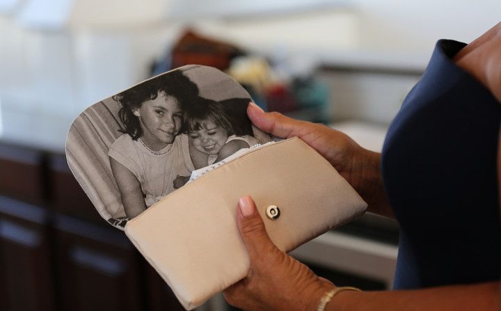 family photo inside clutch - zenobia photography studios