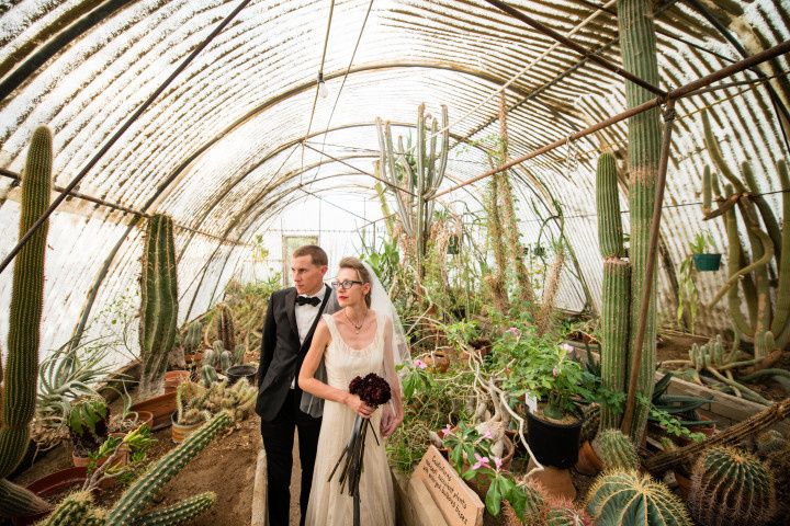 formal couple in greenhouse with cacti 