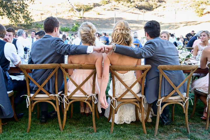 groom and best man fist bump at head table - william innes photography