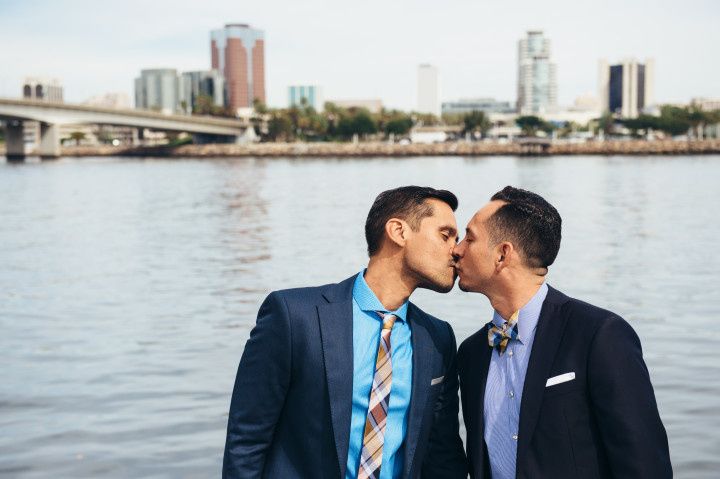 two grooms kissing - derek chad photography
