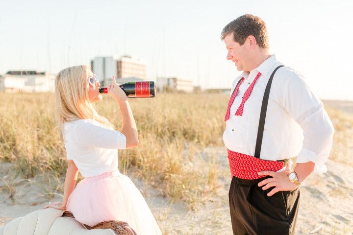 beach engagement with wine