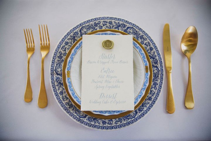 formal blue white and gold place setting hand written menu