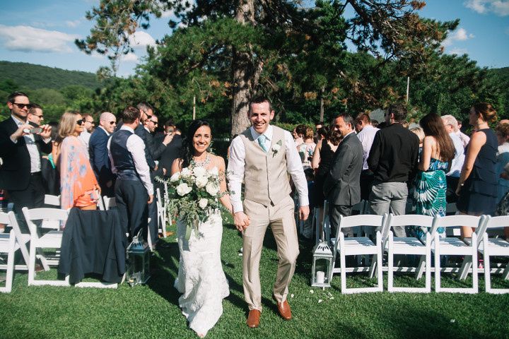 casual outdoor ceremony couple holding hands recessional