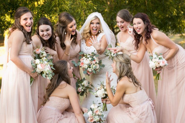 bride showing ring to bridesmaids