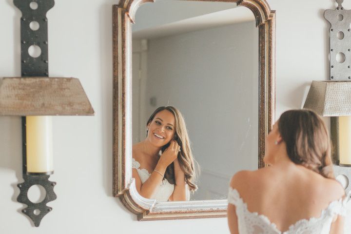 bride looking in mirror 