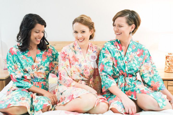 bride and bridesmaids in floral robes 