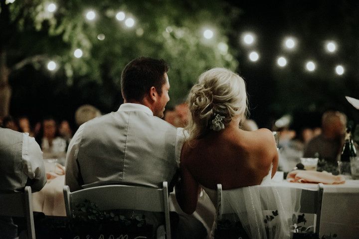 couple seated at reception