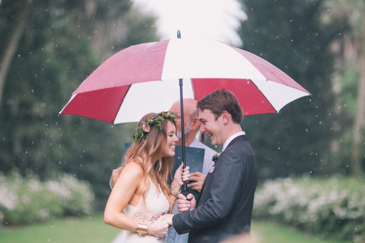 couple rainy ceremony umbrella 