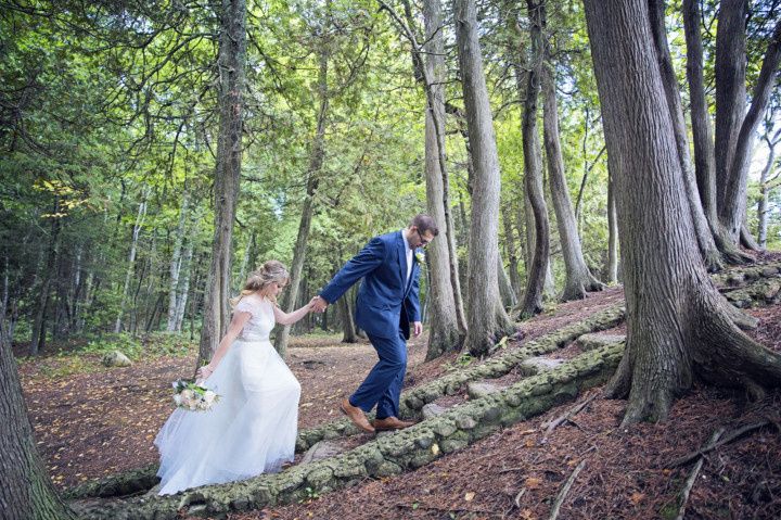 couple walking in woods 