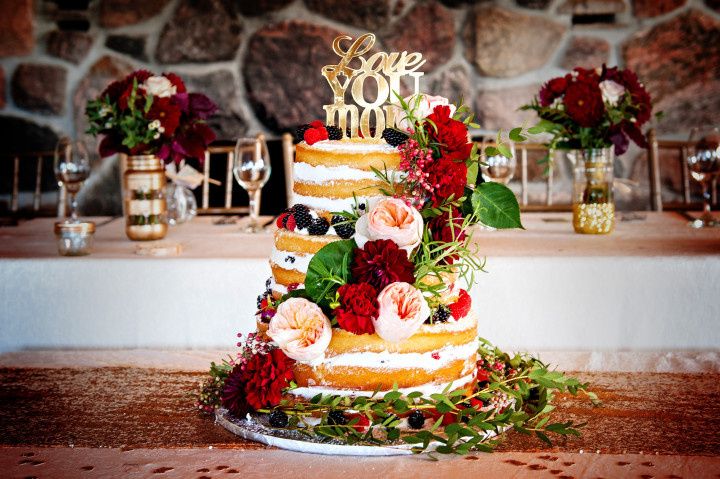 naked cake cascading flowers and laser cut topper