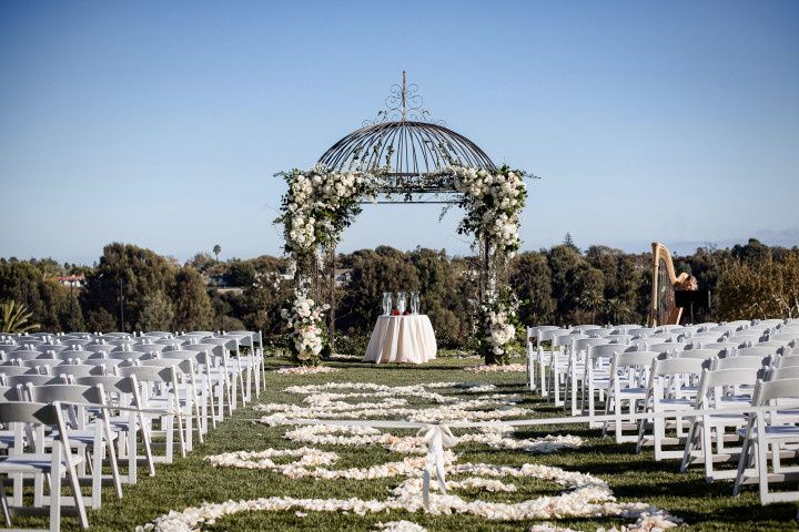 outdoor ceremony with petal lined aisle