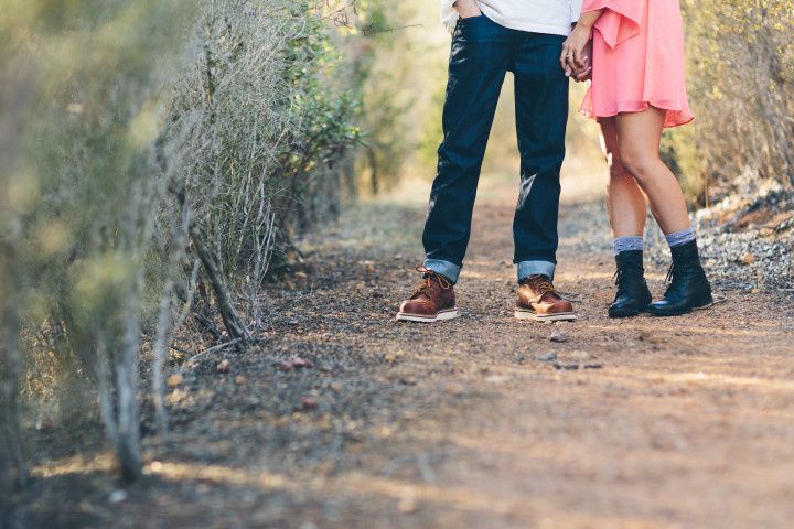 couple kissing in field