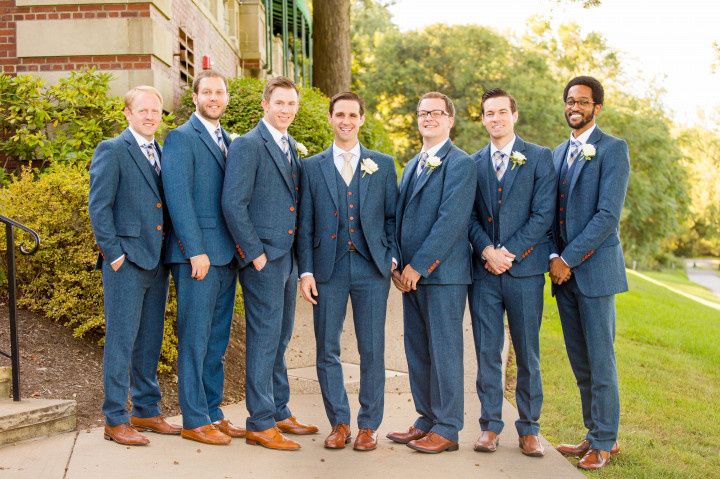 groom and groomsmen in blue suits 