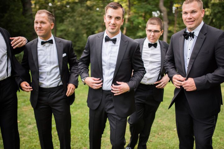 groom and groomsmen in black tuxedos