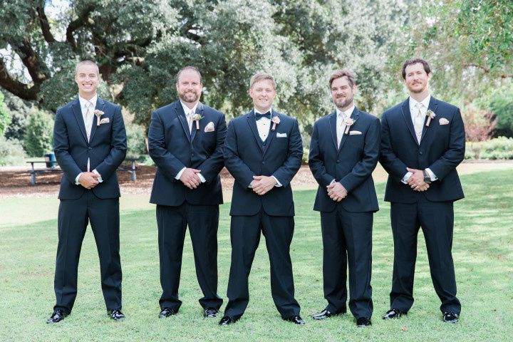 outdoor formal portrait groomsmen black tuxedos 