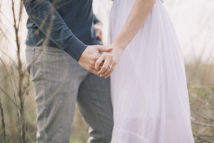 couple holding hands 