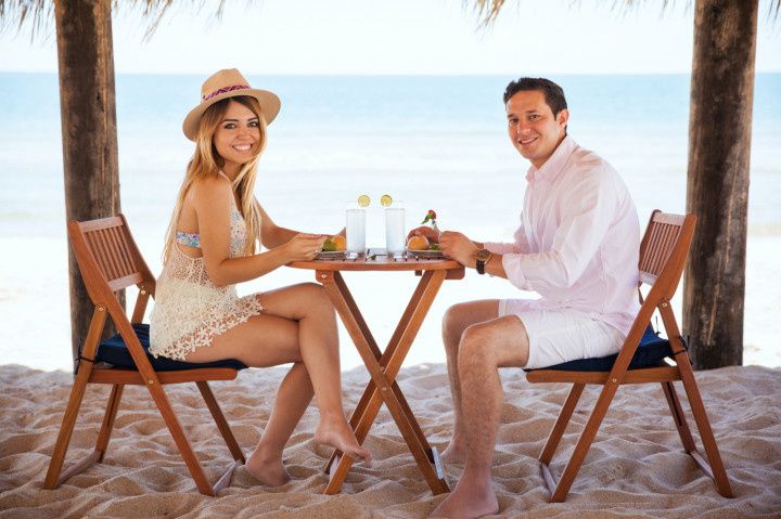 couple eating meal on honeymoon