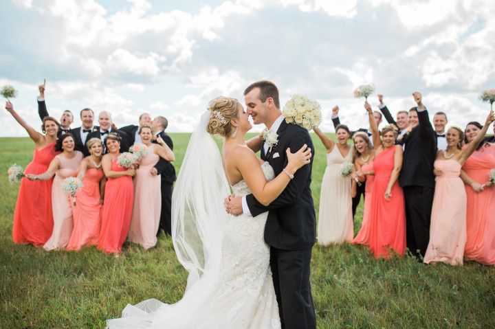 wedding party cheering couple kissing