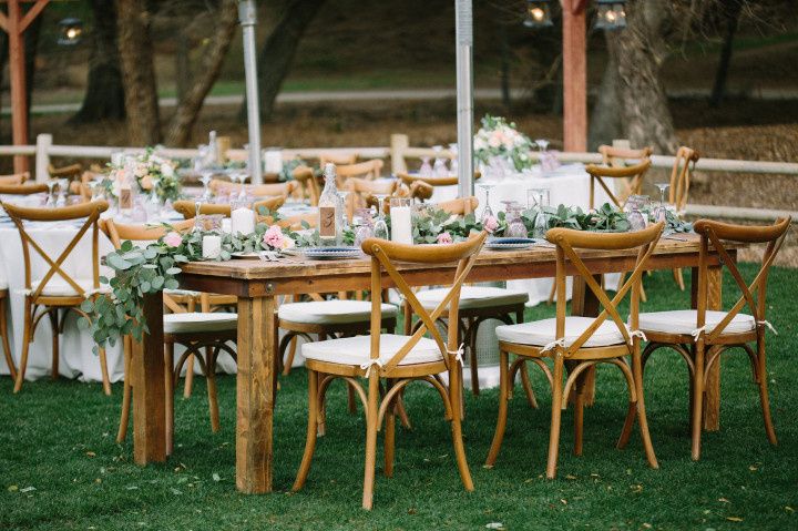 Outdoor tablescape with greenery 