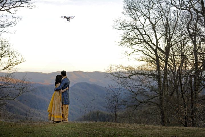 wedding couple with drone