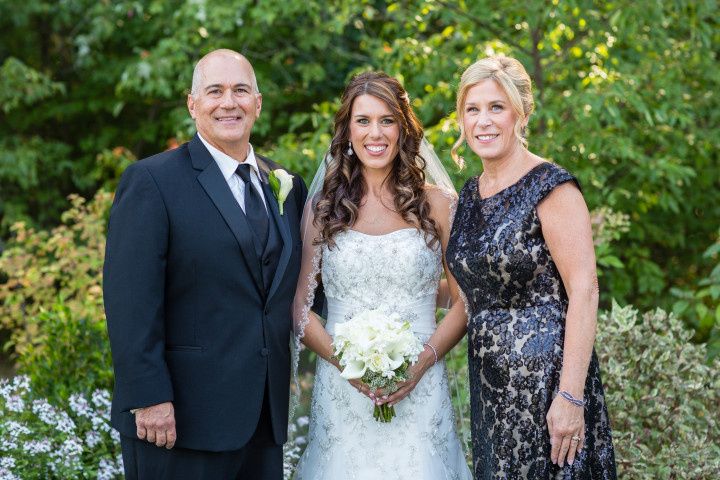 wedding portrait bride with parents formal attire 