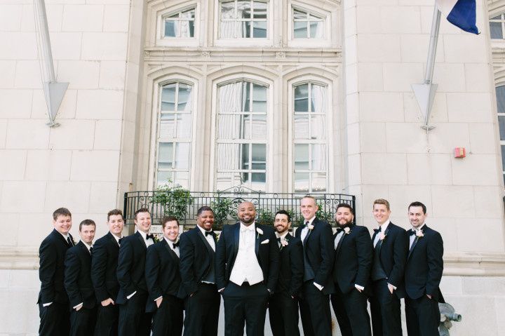 groom and groomsmen wearing tuxedos