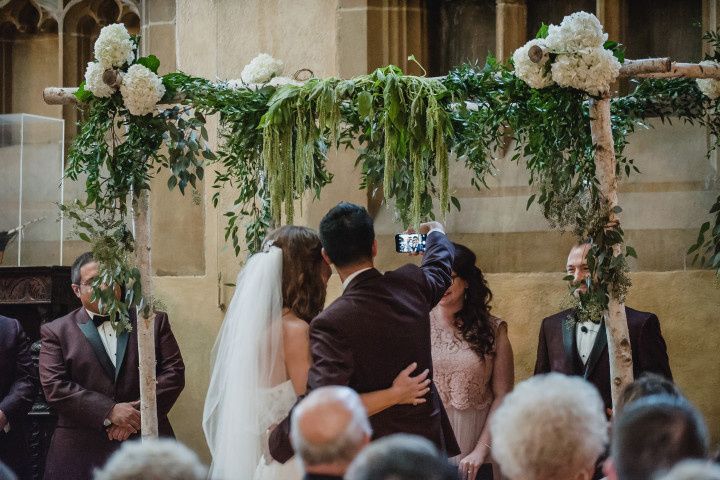 couple taking selfie during ceremony