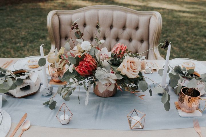 modern wedding centerpiece with greenery