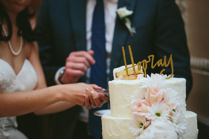cake cutting with hooray gold topper 
