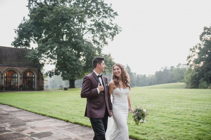 wedding couple walking holding hands 