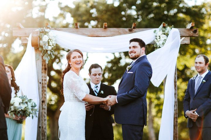 couple at altar vows outdoor ceremony kari kriewald sophisticated whimsy wedding photos