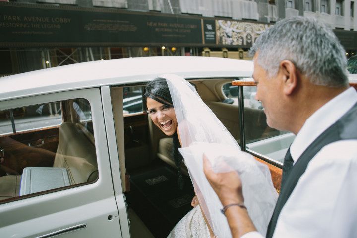 bride entering classic car limo 