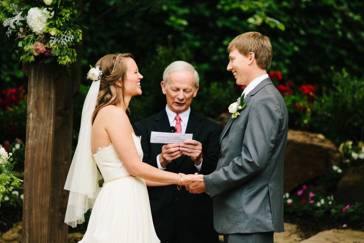 couple laughing during wedding ceremony 